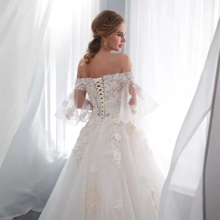 One shoulder wedding dress with back tie.